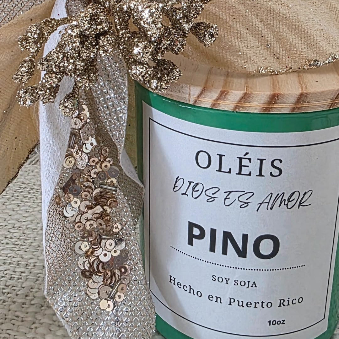 Candle labeled 'Oléis' with decorative bow on a textured surface
