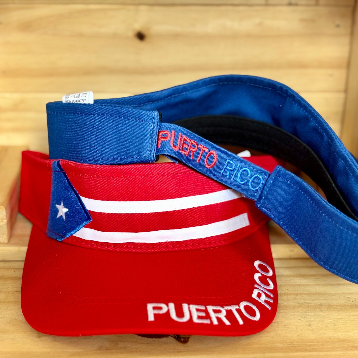 Visor with Puerto Rico flag design on a wooden surface