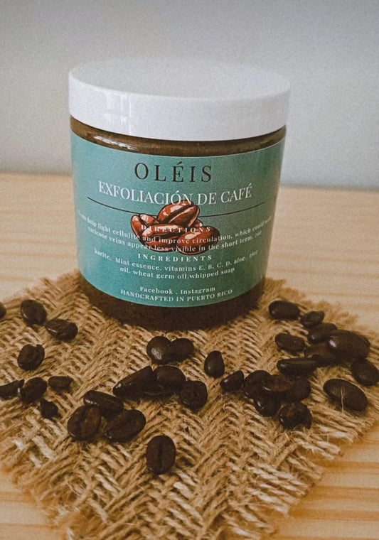 Jar of Oléis coffee scrub with coffee beans on a wooden surface